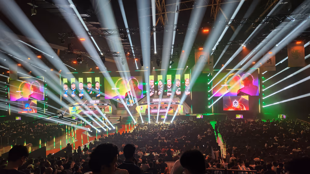 An event stage with spotlights with a large information screen