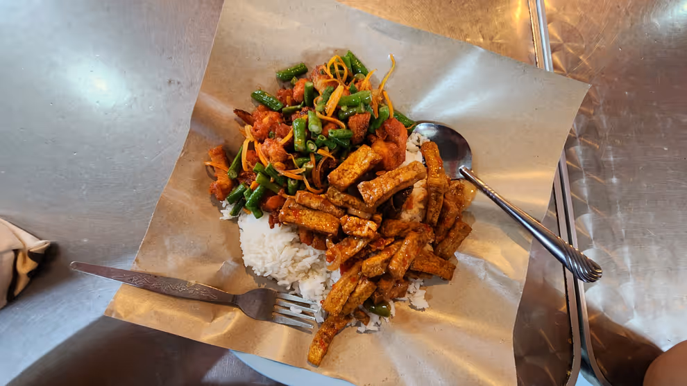 Mixed rice with ayam kunyit and tempeh
